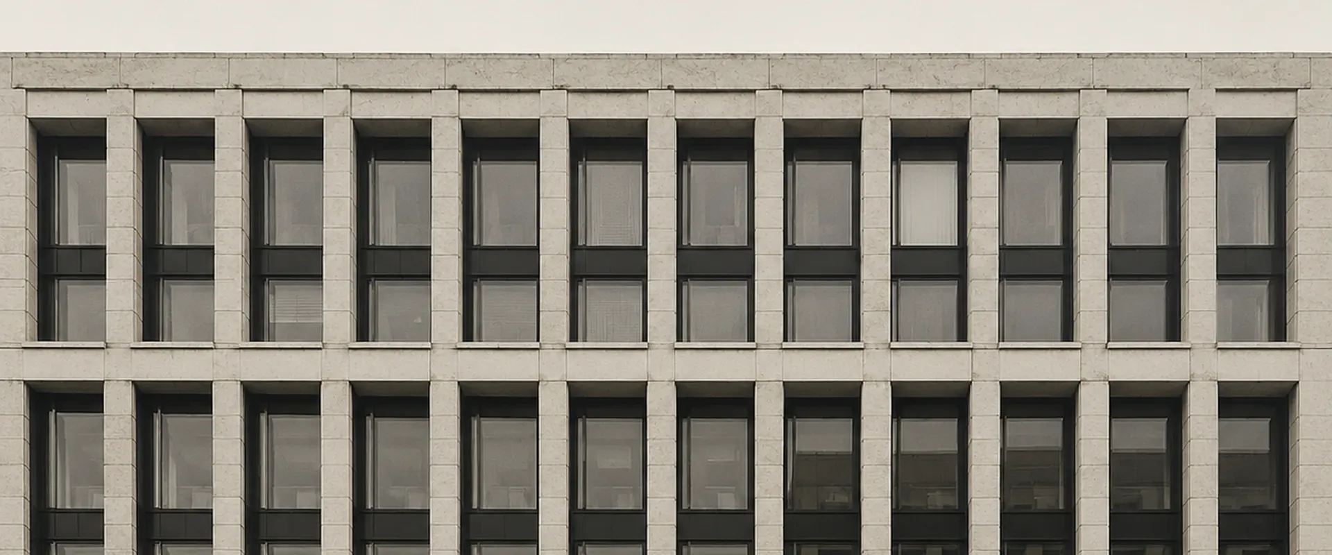 Stone and glass facade of a mid-century office building
